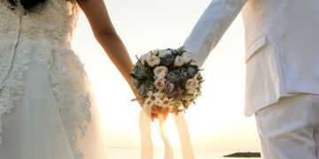 Couple holding hands after marriage