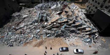 Palestinians building tower after the Israeli airstrikes on Gaza